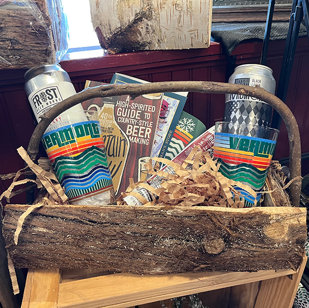 A holiday gift basket with craft beer in it.