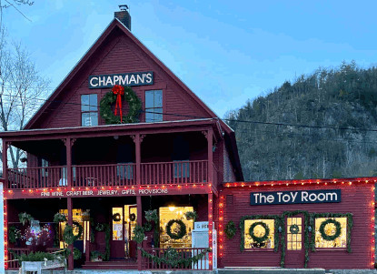 The store at dusk with Christmas lights on.